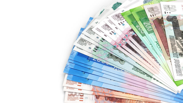 Russian ruble banknotes fanned out on white background