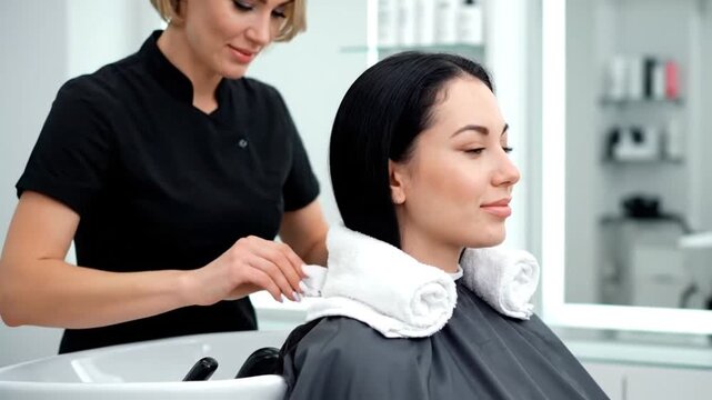 Hairdresser Wrapping Towel Around Client&rsquo;s Neck Before Haircut 