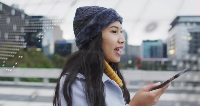 Commuter raising phone to mouth on walkway, engaging world map and code overlays for technology