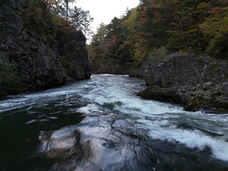 A river with a lot of water and rocks. The water is very clear and the rocks are very big