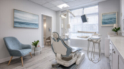 Fototapeta premium Blurred view of a contemporary dental clinic room with blue dental chair, modern tools and white walls, clean and minimalist medical environment