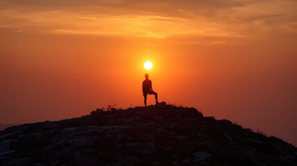 Silhouetted person on hill, radiant orange sunset. Suitable for inspirational, motivational, or travelthemed designs, social media posts, or backgrounds.