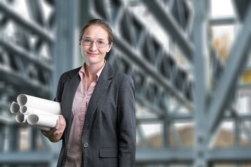 A site engineer working with equipment on construction site outdoors