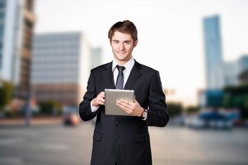 Happy professional businessman posing in office