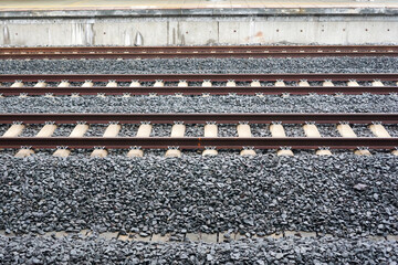 Train tracks with lots of gravel around them