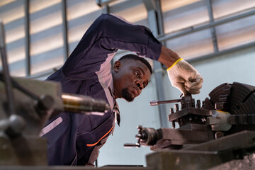 Engineer closely inspecting precision components on a metal lathe machine. Focus, technical expertise, industrial engineering, mechanical work, and manufacturing process.