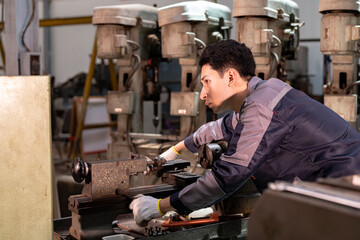 Engineer closely inspecting precision components on a metal lathe machine. Focus, technical expertise, industrial engineering, mechanical work, and manufacturing process.