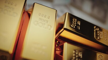 Fine gold bars weighing 1000g stacked on top of scattered hundred-dollar bills, representing wealth, banking reserves, financial success, and a safe-haven investment during economic crisis - Powered by Adobe