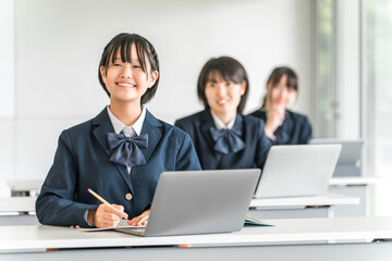 Elementary school, junior high school, and high school students taking classes on tablets and digital computers (ICT education, e-learning)

