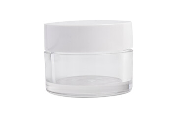 Clear glass cosmetic jar with white lid isolated on white background