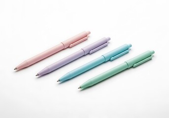 Four pastel colored pens arranged on a white background