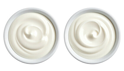 Two bowls of creamy white substance, likely yogurt or sour cream, swirling in ceramic bowls, top-down on a black backdrop