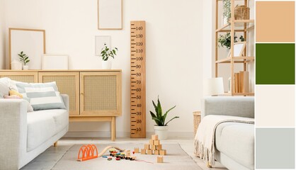 Interior of modern room with sofas, children's toys, commode and wooden stadiometer. Different color patterns