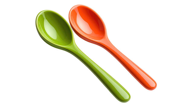 Two colorful plastic spoons (one green, one red) lay diagonally against a stark black background