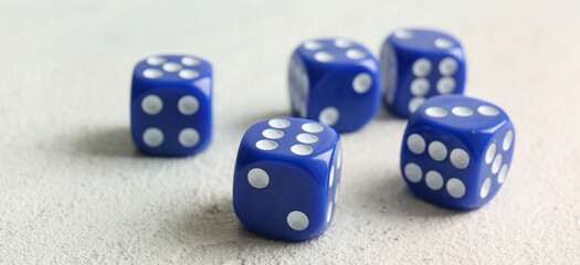 Blue dices on light background