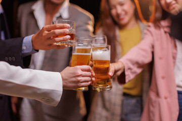 Happy Group of people Asian friends Drinking beer outdoors at the brewery for the New Year festival night time
people