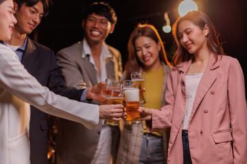 Happy Group of people Asian friends Drinking beer outdoors at the brewery for the New Year festival night time
people