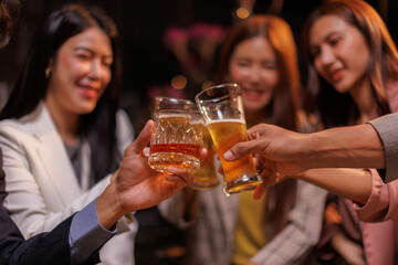Happy Group of people Asian friends Drinking beer outdoors at the brewery for the New Year festival night time
people