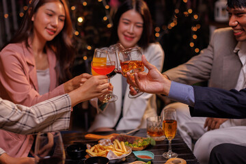 Group of people Throw a party Celebrate whiskey at a friendly party in a restaurant. Night.
