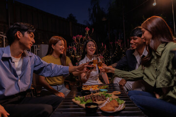 Glasses of Happy friends rose wine seen during a friendly party of a celebration.
