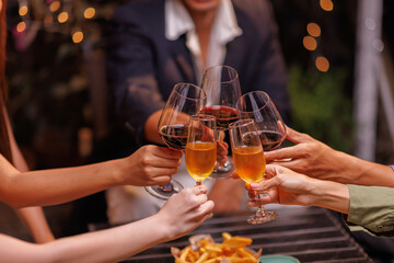 Group of people toasting with champagne glasses at a celebration. Hands holding champagne, clinking glasses. Festive atmosphere, joyful celebration, champagne toast. People toasting with champagne.
