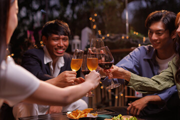 Group of people toasting with champagne glasses at a celebration. Hands holding champagne, clinking glasses. Festive atmosphere, joyful celebration, champagne toast. People toasting with champagne.
