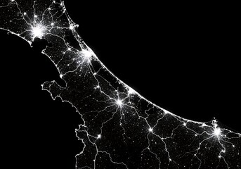 Nighttime aerial view of coastal city lights