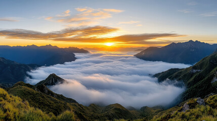Obraz premium Golden sunrise above fog covered mountains creates serene landscape filled with beauty