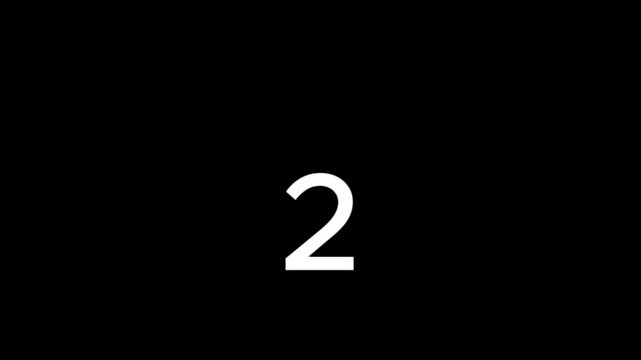 A blurry white dot is visible against a completely black background