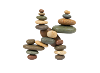 Various river stones are stacked vertically forming the letter H symbolizing balance, stability, and initials.