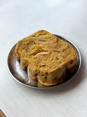 A plate of food with a piece of bread on it