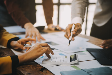 Group of Young Asian business team creative businesspeople coworker in office Happy to be successful partnership teamwork celebrating achievement and success concept.