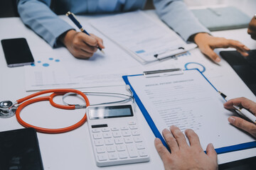 Meeting, tablet and team of doctors with collaboration for healthcare talk and telehealth app in office. Surgeon group, tech and medical discussion with website for hospital funding or sponsorship