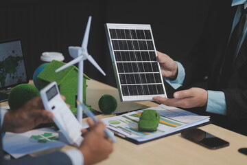 Green energy business company meeting with business people planning and discuss marketing of sustainable and renewable clean energy product with solar cell and wind turbine generator. Trailblazing