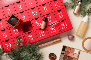 Advent calendar, different cosmetic products and Christmas decor on white grunge background