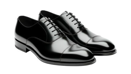 Polished black leather formal shoes display strong reflections against a dark background