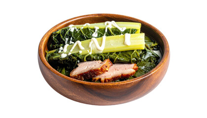 Bowl of greens, meat, and white sauce topping