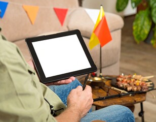 Businessman holding a digital tablet with a blank screen for mobile communication