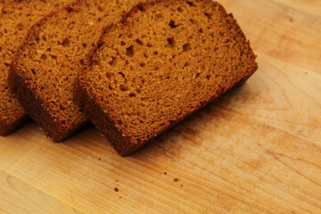 Fresh Homemade Pumpkin Bread Sliced on Wooden Cutting Board