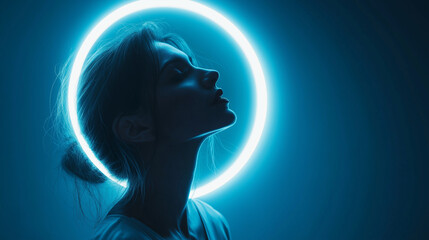 Beautiful woman silhouetted with vibrant neon halo, modern art portrait with a futuristic vibe