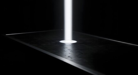 A bright, strong, white vertical laser light beam hitting a dark, reflective floor or surface, symbolizing data transfer, security, or future technology