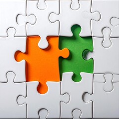 Fototapeta premium White puzzle pieces with orange and green background filling missing spaces