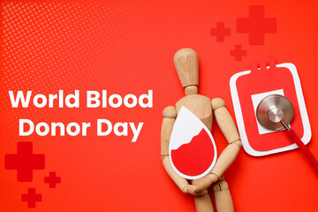 Wooden figure holding a blood drop symbol on a bright background