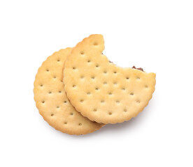 Delicious sandwich biscuits with chocolate cream on white background