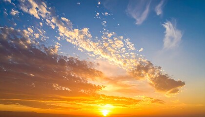 A vibrant sunset painting the sky with orange and blue hues, puffy clouds