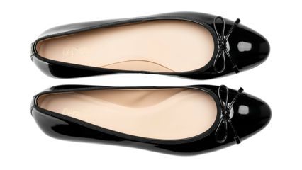 Pair of shiny black ballet flats displayed against a solid dark background