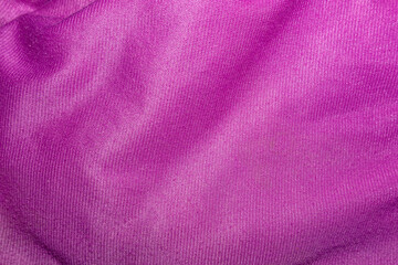 Purple Fabric Texture Background with Soft Wrinkled Textile Surface. Ideal for Use in Design Backgrounds, Material Overlays, or Fashion Presentation Mockups.