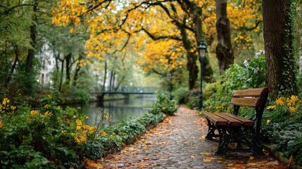 Naklejka premium Scenic Autumn Park with Bench, River, and Golden Foliage in Bruges, Belgium