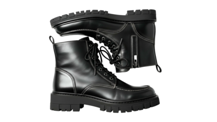 Pair of shiny black lace up combat boots displayed against a dark background