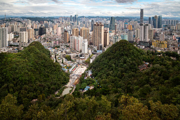 Guiyang City Surrounded by Green Hills and Urban Skyline